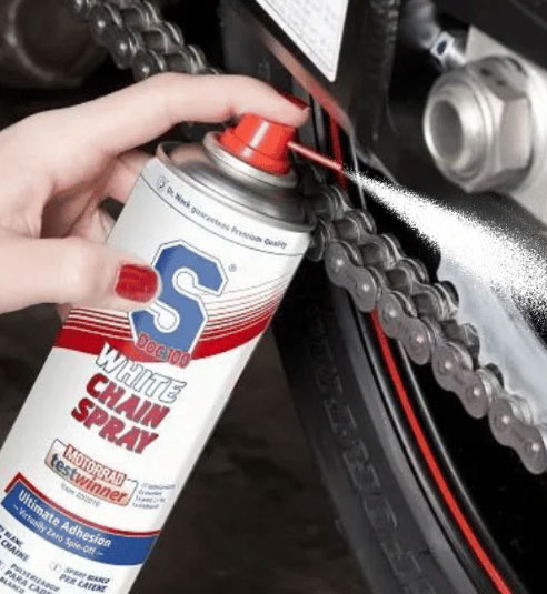Applying lubricant to an ATV chain
